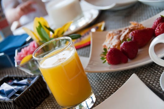 Breakfast  with orange juice and fresh strawberryes