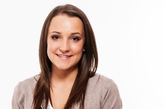 Portrait of a pretty female teenager against a white background