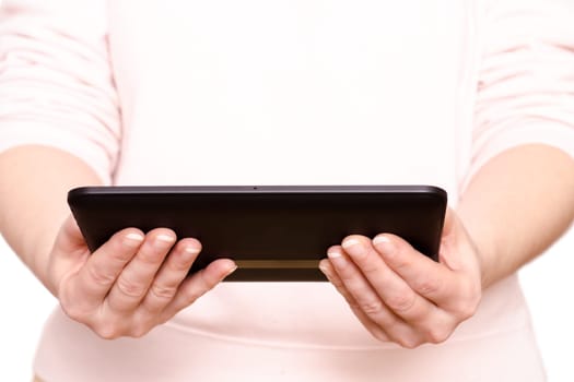 Two hands of a woman holding a tablet computer