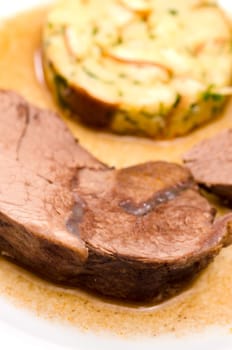 Braised roast of wild boar and pretzel napkin dumplings