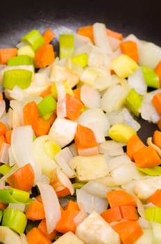 Stewed root vegetables in a pan