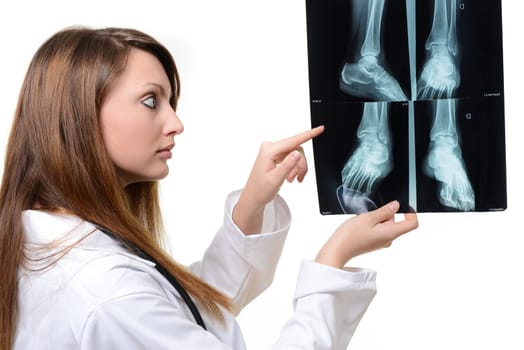 female doctor with x-ray in hand over a white background