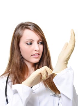 Pretty female doctor is putting protective glove