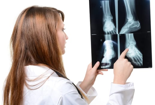 female doctor with x-ray in hand over a white background