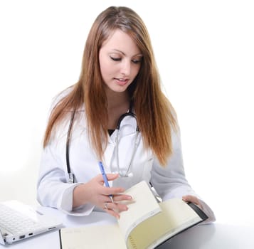 Pretty female doctor isolated writing in a Planner