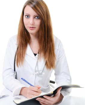 Pretty female doctor isolated writing in a Planner