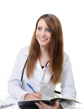Pretty female doctor isolated writing in a Planner