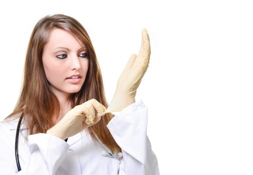 Pretty female doctor is putting protective glove
