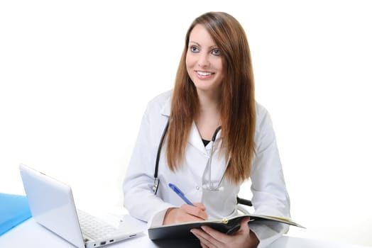 Pretty female doctor isolated writing in a Planner