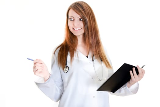 Pretty female doctor isolated writing in a Planner