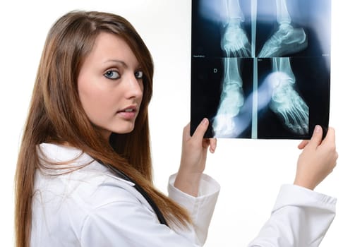 female doctor with x-ray in hand over a white background