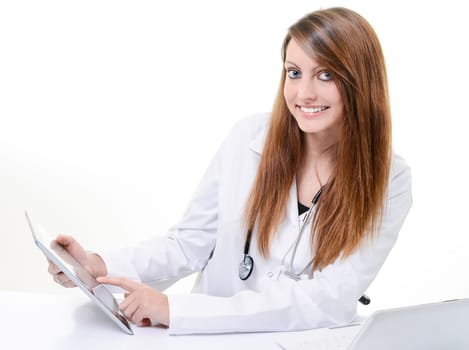 Pretty female student doctor working with an digital tablet