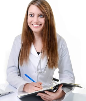 Pretty female doctor isolated writing in a Planner