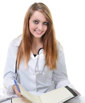 Pretty female doctor isolated writing in a Planner