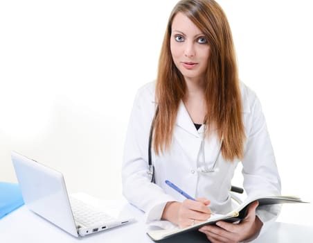 Pretty female doctor isolated writing in a Planner