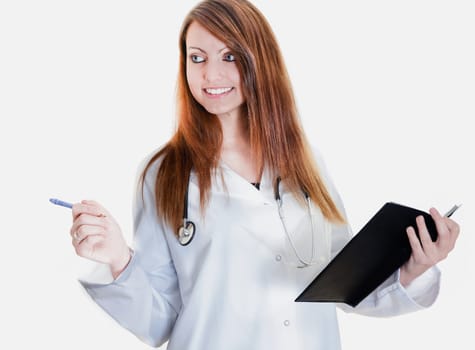 Pretty female doctor isolated writing in a Planner