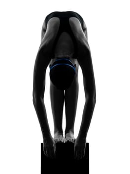 one caucasian woman competion swimmer on starting in silhouette studio isolated on white background