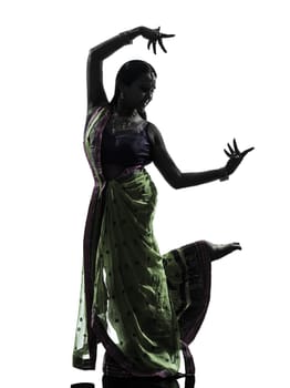 one indian woman dancer dancing in silhouette studio isolated on white background