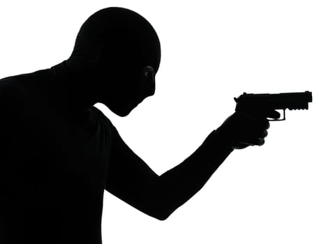 thief criminal terrorist man aiming gun in silhouette studio isolated on white background