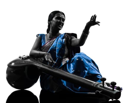 one indian tempura musician woman in silhouette studio isolated on white background
