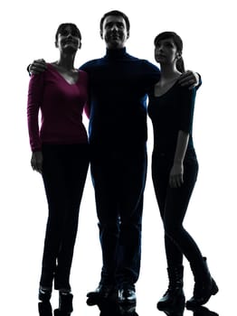 one caucasian family father mother daughter standing full length looking up  in silhouette studio isolated on white background