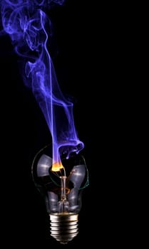 Light bulb with blue smoke