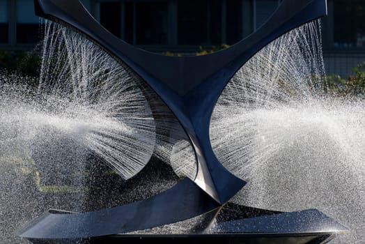 Modern fountain in a park in summer