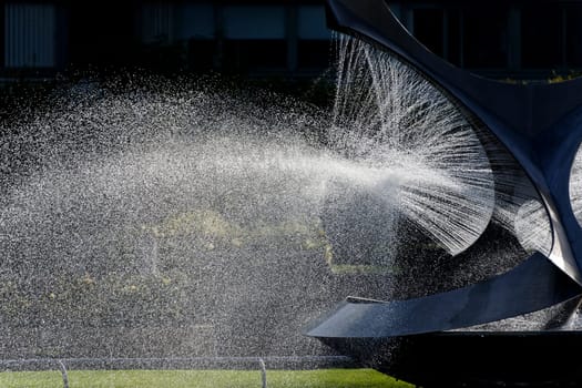 Modern fountain in a park in summer