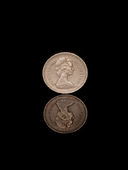 Reflected pound coin