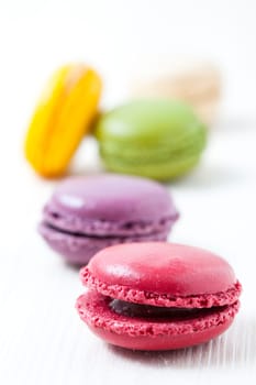Close-up of colorful macaroons on light background
