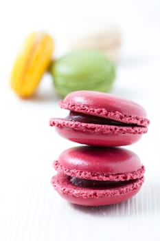 Close-up of colorful macaroons on light background