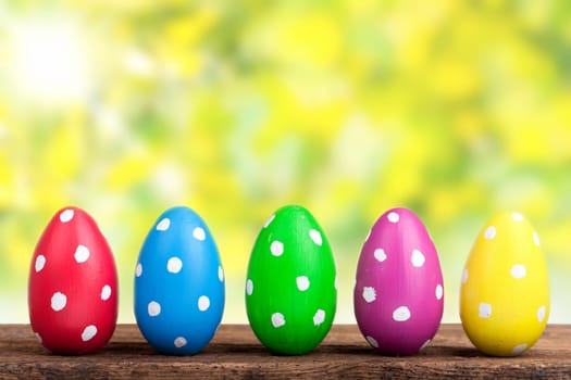 Colorful Easter eggs against natural background