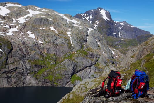 Picturesque scenery on Lofoten islands in Norway with two backpacks