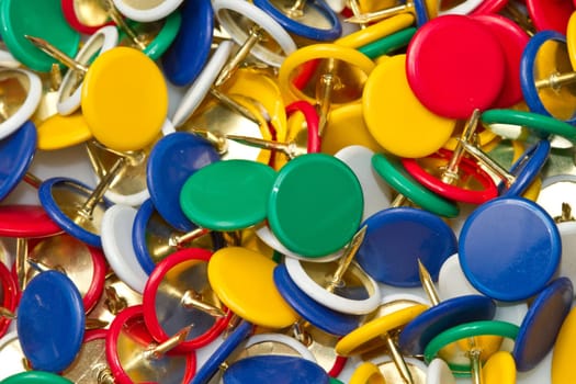 a group of colored pushpins