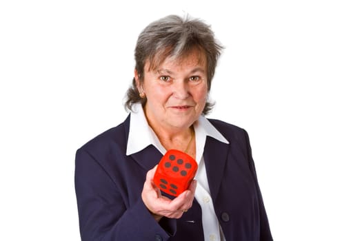 Successful senior woman showing a cube