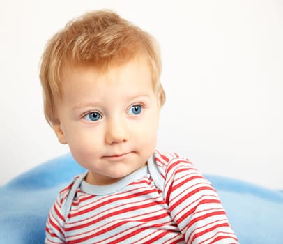 Studio portrait of a happy one year old baby boy.