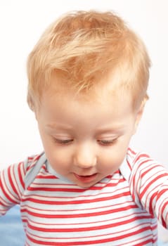 Amazed expression of a happy one year old baby boy.