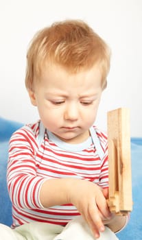 Studio portrait of a sad one year old baby boy.