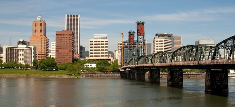 Portland Oregon USA View Across Willamette River to Downtown includes Hawthorne Bridge, a daytime scene in North America