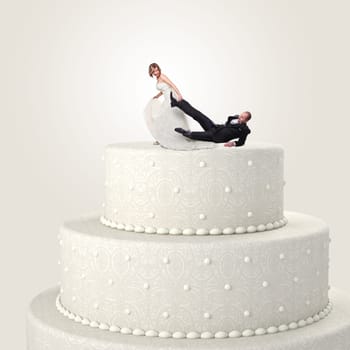 funny groom and bride on cake top