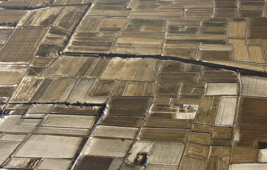 Light snow on plowed fields