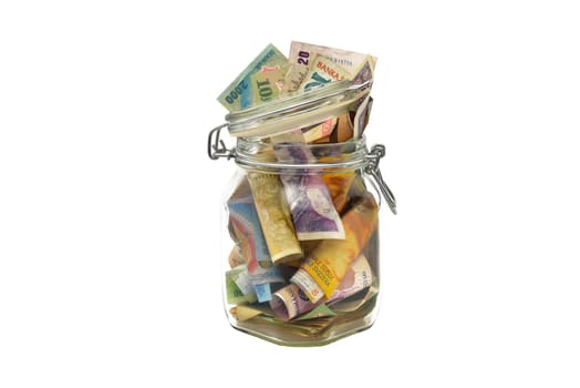 Old banknotes in a glass jar
