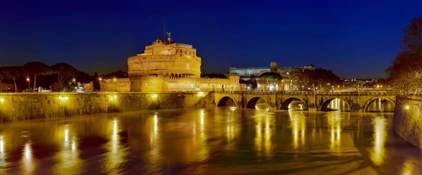 Bridge, castel Sant'angelo and Tiber river at dawn