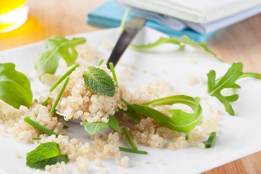 Fresh quinoa salad with herbs and arugula