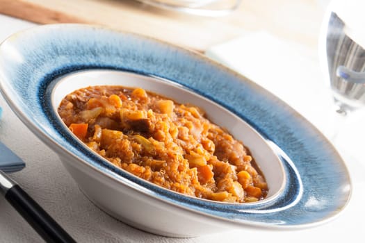 Fresh homemade quinoa stew with fresh vegetables.