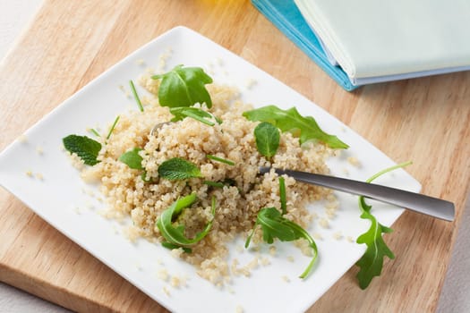 Fresh quinoa salad with herbs and arugula