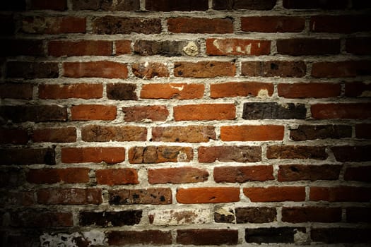 Brick texture with copyspace and spotlight.