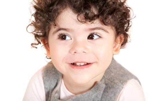 Two year old girl with curly hair portrait, studio shot.