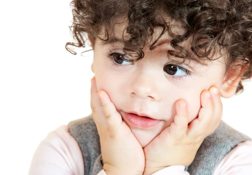 Two year old girl with curly hair portrait, studio shot.