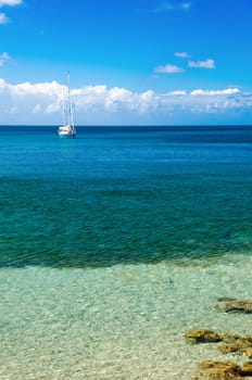A yacht in beautiful blue Caribbean water in San Andres y Providencia, Colombia